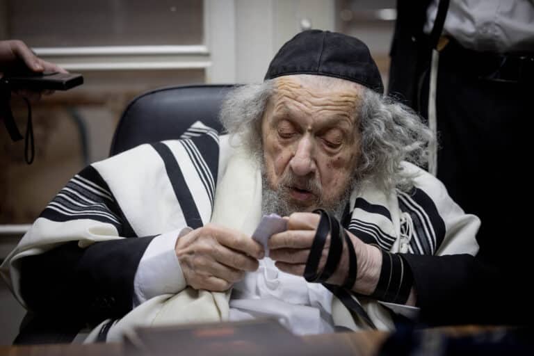 a man in a black and white robe