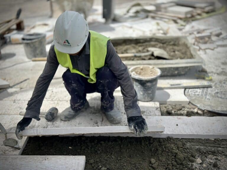 a man wearing a hard hat and safety vest