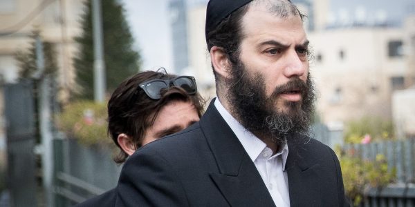 **FILE** Motti Babchik seen as Israel Health Minister Yaakov Litzman casts his ballot at a voting station in Jerusalem, during the Knesset Elections, on March 2, 2020. Photo by Yonatan Sindel/Flash90 *** Local Caption *** מצביע
בחירות
כנסת
הצבעה
קלפי
מוטי בבצ'יק
יעקב ליצמן
שר הבריאות